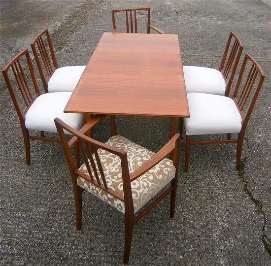 A Gordon Russell teak extending dining table and six chairs (4+2 carvers)